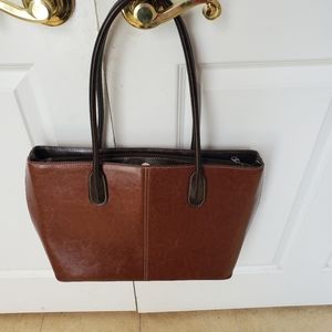 Cognac/chocolate faux leather.3 compartments.loop handle